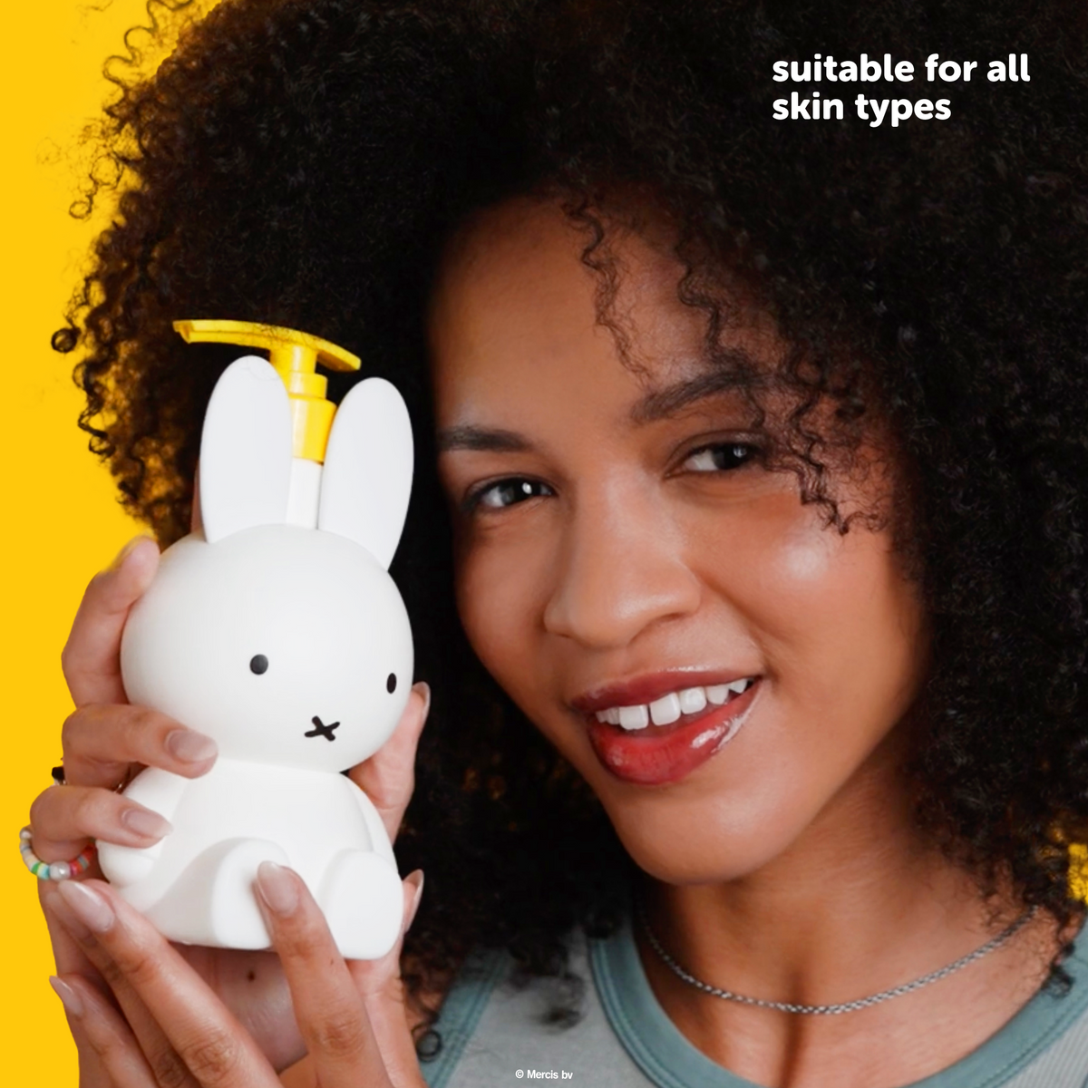 Miffy Sweet Wonder Shower Gel — model holding the Miffy shower gel bottle