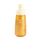 Tropic Lush Shimmering Body Oil — uncapped bottle showing the pump