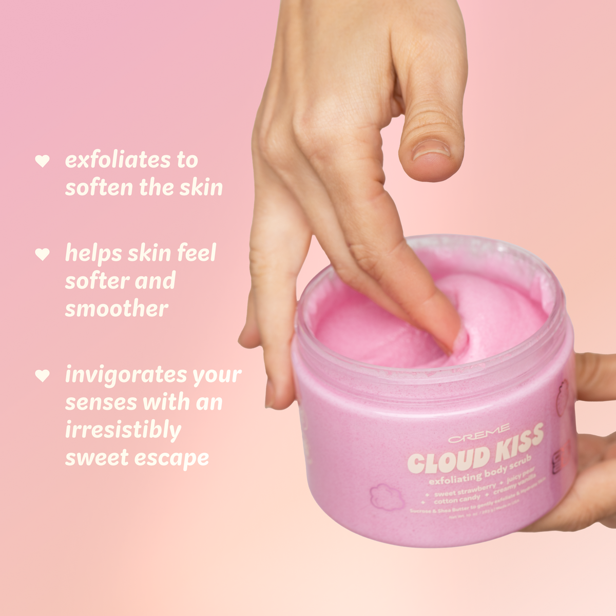Cloud Kiss Exfoliating Body Scrub — hand scooping pink scrub with exfoliation benefits