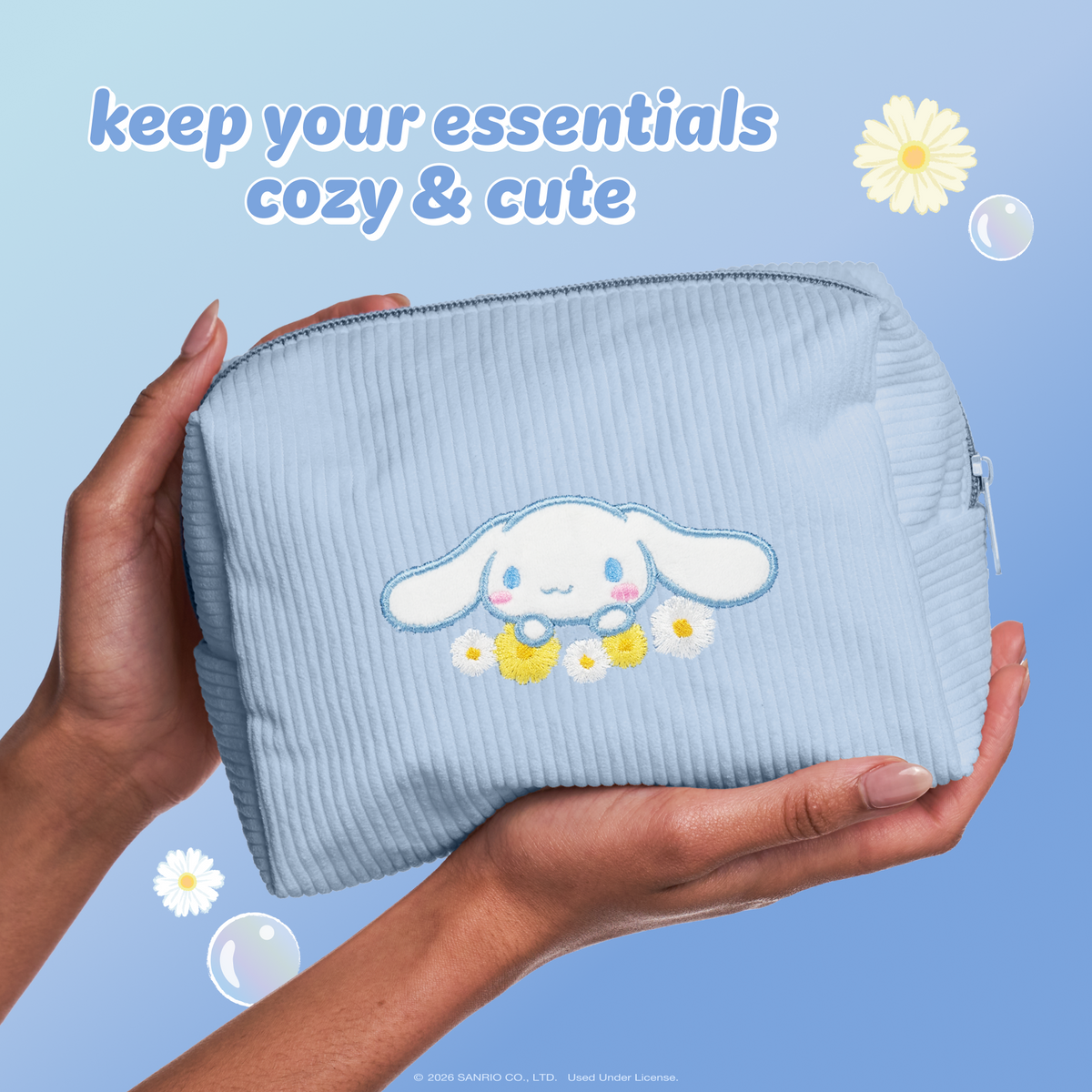 Cinnamoroll Dream Daisy Makeup Bag — hands holding the blue Cinnamoroll makeup bag