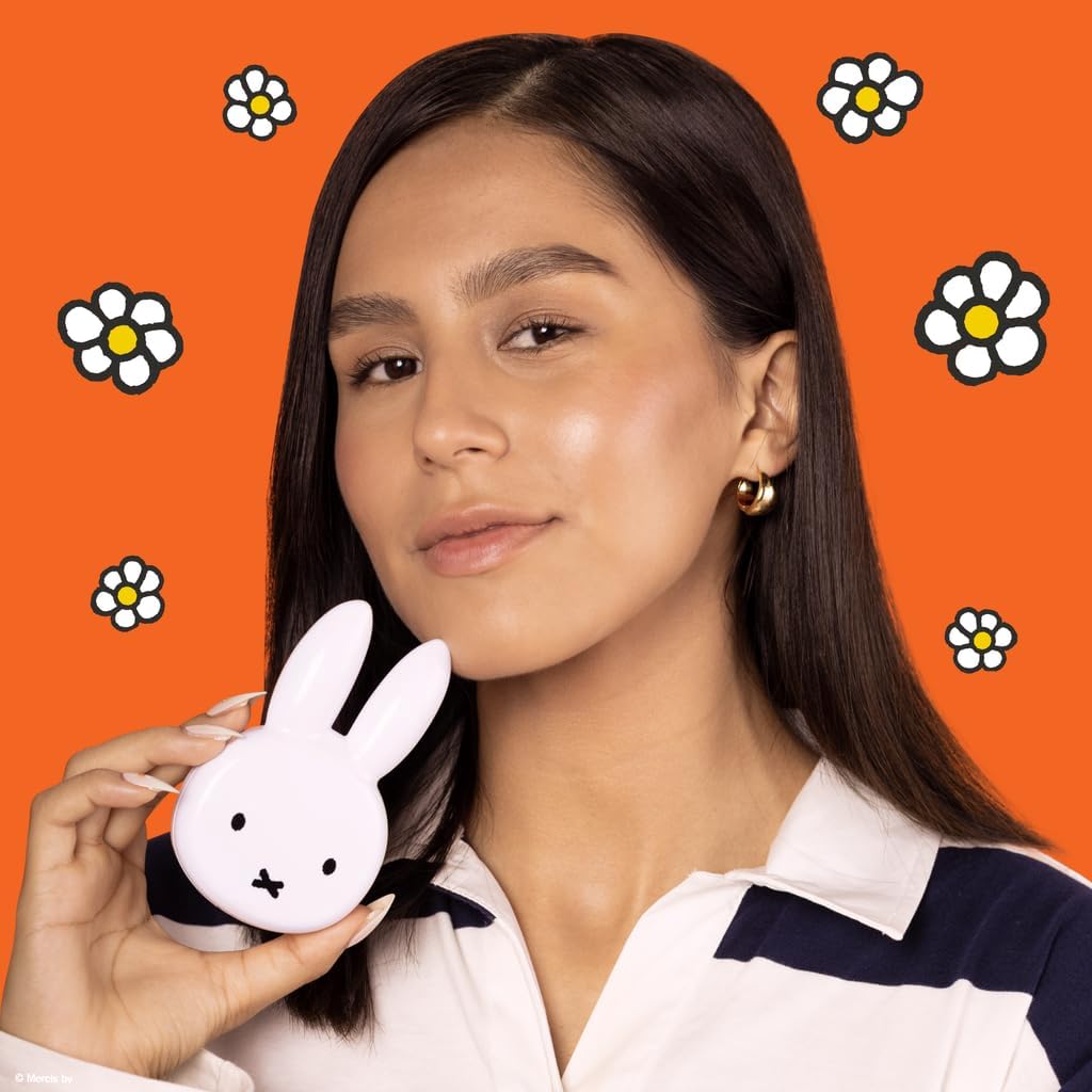 Miffy On-the-Go Compact Mirror — model holding the rabbit-shaped mirror beside her face