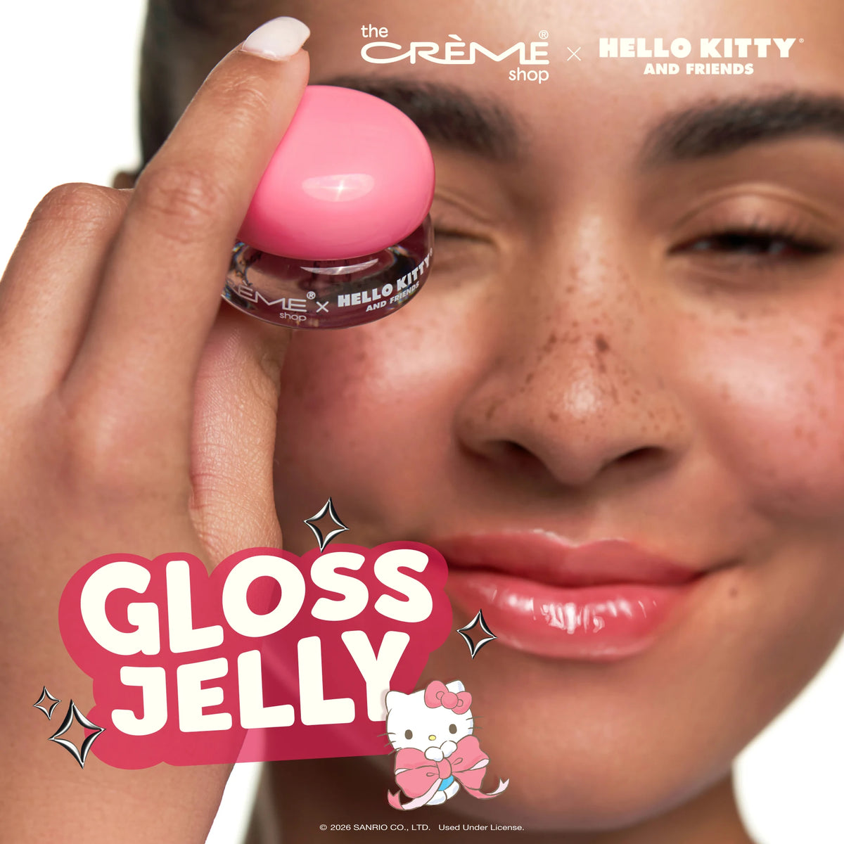 Gloss Jelly Lip Glaze — Berry Cherry — model holding the pink-lidded jar beside her face